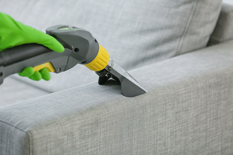professional cleaner cleaning upholstery